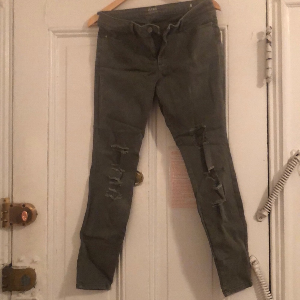 Army green jeggings with rips in knees